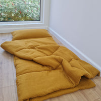 Special listing for Casey Heitmann one 38"L x 26" W hemp sleeping bag with pillow in mustard linen fabric, with white thread embroidery of the Rowen name, with a grey mat inside 2.3" thick