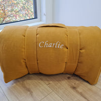 Special listing for Casey Heitmann one 38"L x 26" W hemp sleeping bag with pillow in mustard linen fabric, with white thread embroidery of the Rowen name, with a grey mat inside 2.3" thick